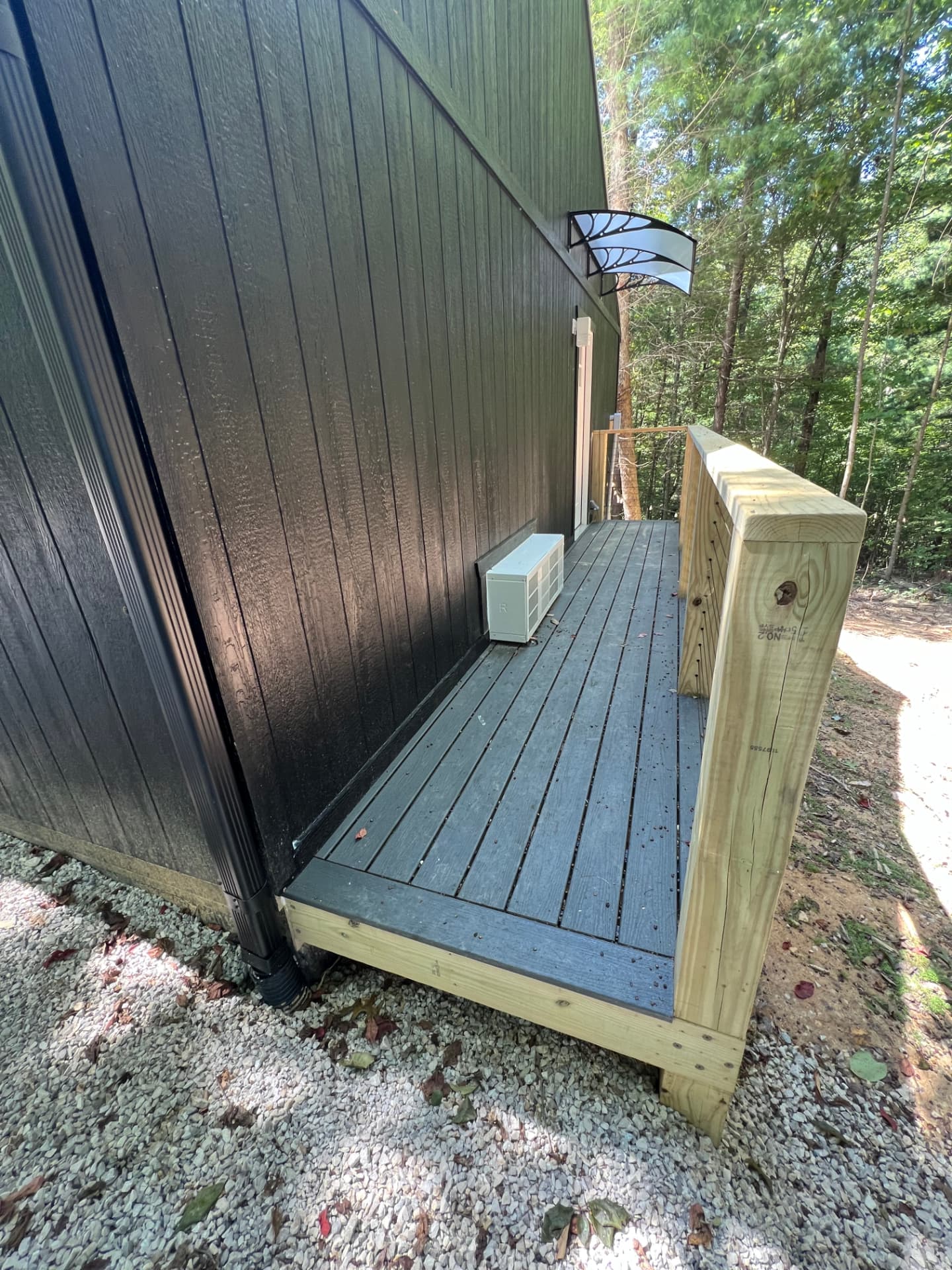 Composite side deck with pressure-treated railing